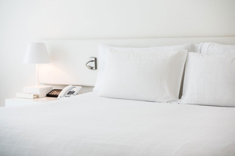 White bed with white pillows